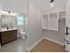 Modern bathroom with vanity, shower, and walk-in closet at 800 Embassy Rd, Largo, FL 33771