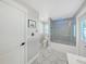 Contemporary bathroom showcasing a tiled shower-tub combination, modern fixtures, and sleek design elements at 800 Embassy Rd, Largo, FL 33771