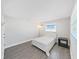 Bedroom featuring hardwood floors, a window for natural light, and minimalist decor at 800 Embassy Rd, Largo, FL 33771