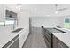 Well-designed kitchen with stainless steel appliances, a cooktop island, and ample counter space at 800 Embassy Rd, Largo, FL 33771