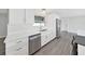 Modern kitchen featuring stainless steel appliances, white cabinetry, and stylish countertops at 800 Embassy Rd, Largo, FL 33771