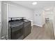 Functional laundry room with modern washer and dryer, complemented by ample storage space at 800 Embassy Rd, Largo, FL 33771