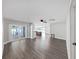 Bright living room featuring hardwood floors, plenty of natural light, and access to a screened patio at 800 Embassy Rd, Largo, FL 33771