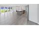 Bright, airy living room with stylish flooring and a kitchen island for modern living at 800 Embassy Rd, Largo, FL 33771