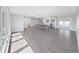 A modern living room showcasing hardwood floors and an open layout with an island at 800 Embassy Rd, Largo, FL 33771