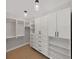 Spacious walk-in closet with modern shelving and drawers, offering ample storage space at 800 Embassy Rd, Largo, FL 33771