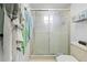 Bathroom featuring a white toilet and a glass shower enclosure with a sliding glass door at 8268 Garrison St, Spring Hill, FL 34606
