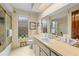 Bathroom showing a single sink vanity with a large mirror and a shower/tub combo at 8268 Garrison St, Spring Hill, FL 34606
