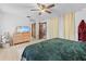 Comfortable bedroom with a bed, wooden dresser, and natural light, creating a relaxing space at 8268 Garrison St, Spring Hill, FL 34606