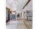 Bright entryway featuring modern decor, light wood floors, and a stylish storage unit at 8268 Garrison St, Spring Hill, FL 34606