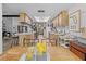Open kitchen with modern appliances, a wooden table and chairs, and wooden cabinets at 8268 Garrison St, Spring Hill, FL 34606