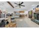 The living room features an open floor plan and a rustic stone fireplace at 8268 Garrison St, Spring Hill, FL 34606