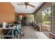 This covered patio includes multiple bikes, exercise equipment and screens at 8268 Garrison St, Spring Hill, FL 34606