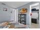 Comfortable bedroom with a patterned quilt and decoratively organized shelving at 8310 Pat Blvd, Tampa, FL 33615