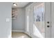 Elegant foyer showcasing a decorative glass door and a pristine, light-filled entrance at 8310 Pat Blvd, Tampa, FL 33615