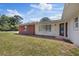 Attractive brick home featuring a well-kept lawn and a charming front entrance at 8310 Pat Blvd, Tampa, FL 33615