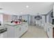 Open-concept kitchen flows into the living and dining areas, perfect for entertaining at 8310 Pat Blvd, Tampa, FL 33615