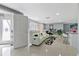 Modern living room featuring tile floors, comfortable seating, and an open, airy design at 8310 Pat Blvd, Tampa, FL 33615