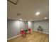 Inviting room with new laminate flooring, neutral walls, stylish curtains, and seating area at 8310 Pat Blvd, Tampa, FL 33615