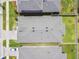 An aerial view shows the home's layout and surrounding landscaping at 9316 Crescent Ray Dr, Wesley Chapel, FL 33545