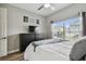 Bedroom featuring ceiling fan and a view to the outside at 9316 Crescent Ray Dr, Wesley Chapel, FL 33545