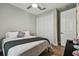 Neutral bedroom featuring a ceiling fan, closet, and wood-look floors at 9316 Crescent Ray Dr, Wesley Chapel, FL 33545