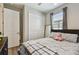 Bedroom features closet, window, and neutral decor. Suitable for restful nights at 9316 Crescent Ray Dr, Wesley Chapel, FL 33545