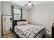 Bedroom with a full-length mirror, ceiling fan, and neutral-colored walls at 9316 Crescent Ray Dr, Wesley Chapel, FL 33545