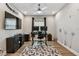 Functional home office with a ceiling fan, decor, and ample workspace at 9316 Crescent Ray Dr, Wesley Chapel, FL 33545