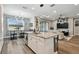 Open-concept kitchen featuring a large island and modern appliances at 9316 Crescent Ray Dr, Wesley Chapel, FL 33545
