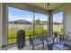 Covered lanai offers seamless indoor-outdoor living with backyard views at 9316 Crescent Ray Dr, Wesley Chapel, FL 33545