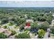 An aerial view showcasing the property's location within a tree-filled neighborhood, offering privacy and a sense of community at 9403 Bellhaven St, Temple Terrace, FL 33637