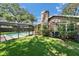 Lush backyard featuring a serene pool area, perfect for enjoying outdoor living and recreation at 9403 Bellhaven St, Temple Terrace, FL 33637