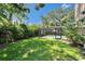 Expansive backyard with a pool area, offering a private oasis for relaxation and entertainment at 9403 Bellhaven St, Temple Terrace, FL 33637