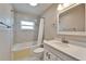 Neutral bathroom featuring shower and bathtub combination, decorative mirror and vanity at 9403 Bellhaven St, Temple Terrace, FL 33637