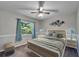 Bedroom with gray walls, carpet flooring, natural light, and a ceiling fan at 9403 Bellhaven St, Temple Terrace, FL 33637