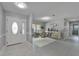 Elegant foyer with tile flooring, a decorative door, and a view of the dining area at 9403 Bellhaven St, Temple Terrace, FL 33637