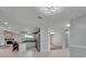 Bright kitchen featuring white cabinets, stainless steel appliances, granite countertops, and bar-style seating at 9403 Bellhaven St, Temple Terrace, FL 33637