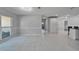 Spacious living area with tile floors, natural light, and ample space for furniture at 9403 Bellhaven St, Temple Terrace, FL 33637