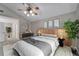 Tranquil main bedroom with stylish decor, light colored carpet, and a spacious closet space at 9403 Bellhaven St, Temple Terrace, FL 33637