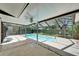 Enclosed swimming pool area, featuring a covered area, perfect for outdoor relaxation and entertainment at 9403 Bellhaven St, Temple Terrace, FL 33637