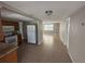 Spacious kitchen with tile flooring, granite countertops, and stainless steel appliances, blending style and functionality at 9411 Rainbow Ln, Port Richey, FL 34668