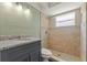 Updated bathroom featuring modern fixtures, a walk-in shower, and granite countertops on the vanity at 10039 Old Hickory Ln, Port Richey, FL 34668