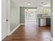 Open-concept living space boasts fresh paint, new floors, and a seamless transition to the modern kitchen at 10039 Old Hickory Ln, Port Richey, FL 34668