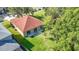 An aerial shot of the backyard showing a green lawn and sliding glass doors to enter the house at 10323 Birdwatch Dr, Tampa, FL 33647