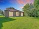Charming backyard with well-kept lawn and scenic natural backdrop, ideal for peaceful outdoor enjoyment at 10323 Birdwatch Dr, Tampa, FL 33647