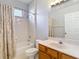 Bathroom with shower/tub combo with tile surround and single sink vanity at 10323 Birdwatch Dr, Tampa, FL 33647