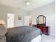 Well-lit bedroom with backyard views and doorways to other rooms at 10323 Birdwatch Dr, Tampa, FL 33647