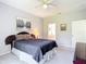 This spacious carpeted bedroom features neutral paint and decor at 10323 Birdwatch Dr, Tampa, FL 33647