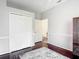 Bright bedroom features hardwood floors, closet, neutral paint and a doorway at 10323 Birdwatch Dr, Tampa, FL 33647